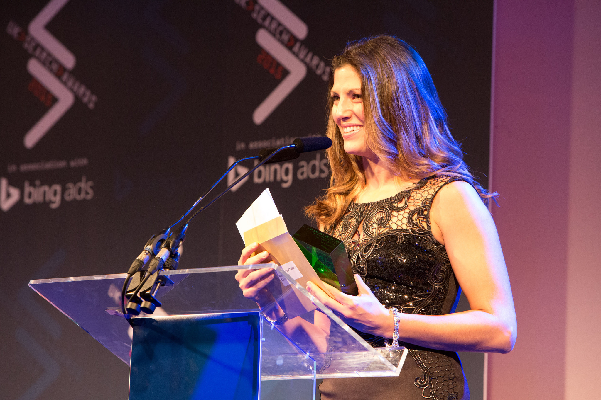 Woman presenting award at UK Search Awards 2015